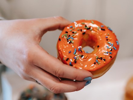 hand holding a doughnut