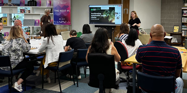 People listening to workshop presentation