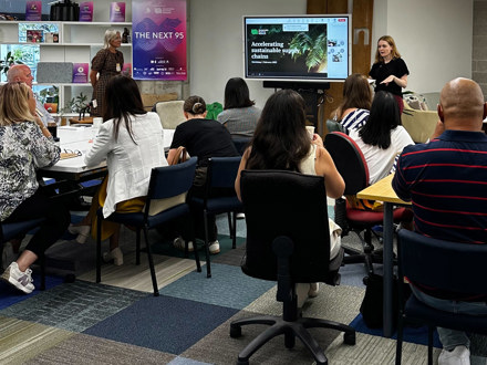 People listening to workshop presentation