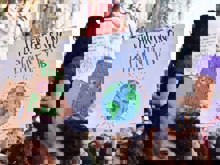 People at climate protest with signs