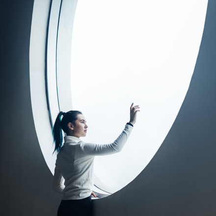 Woman in round window