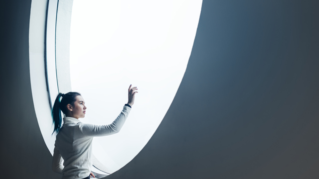 Woman in round window