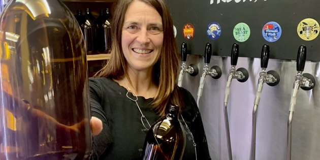 Woman with glass flagons