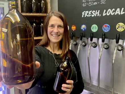 Woman with glass flagons