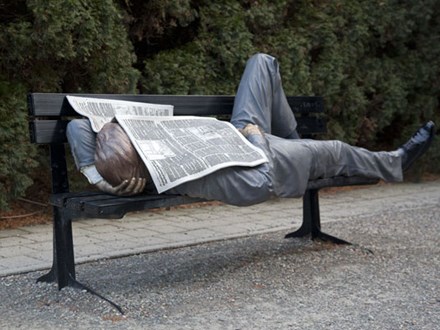Man laying on bench