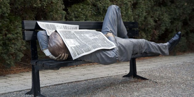Man laying on bench
