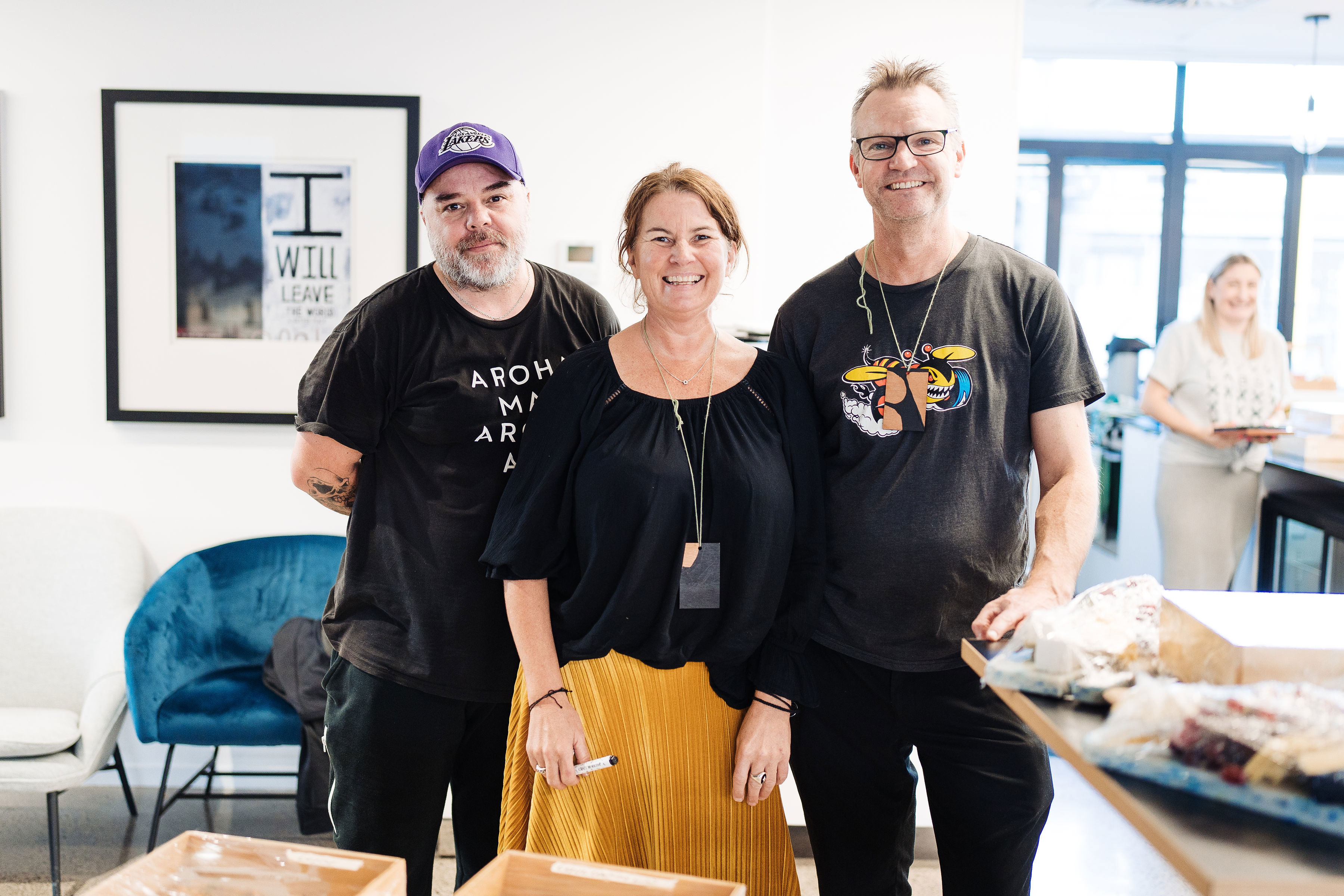 Portrait of three people in store