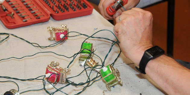 Close up of repairs to wiring for coloured lights