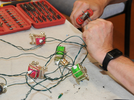 Close up of repairs to wiring for coloured lights