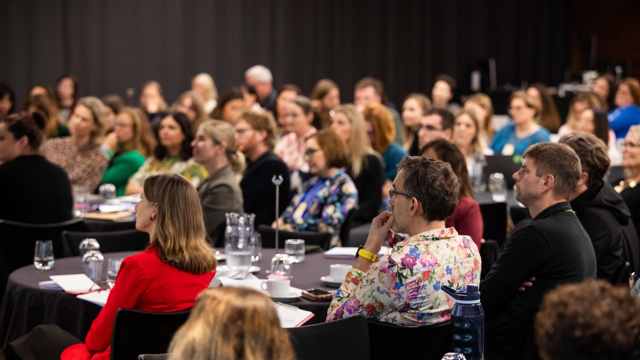 Course attendees listen to presentation