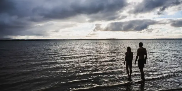 People walking into the sea in Hauraki Gulf