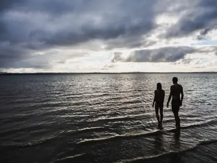 People walking into the sea in Hauraki Gulf