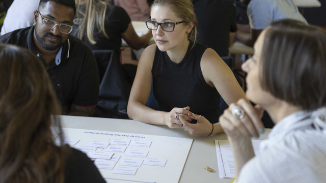 People in discussion around table