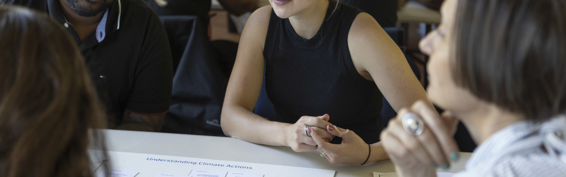 People in discussion around table