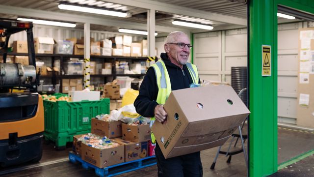 Man carrying box of groceries