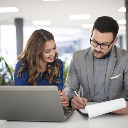 Two young business people in meeting