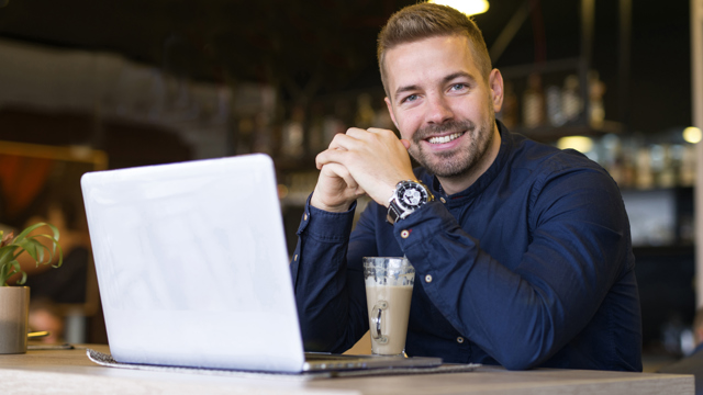Man in cafe with laptop
