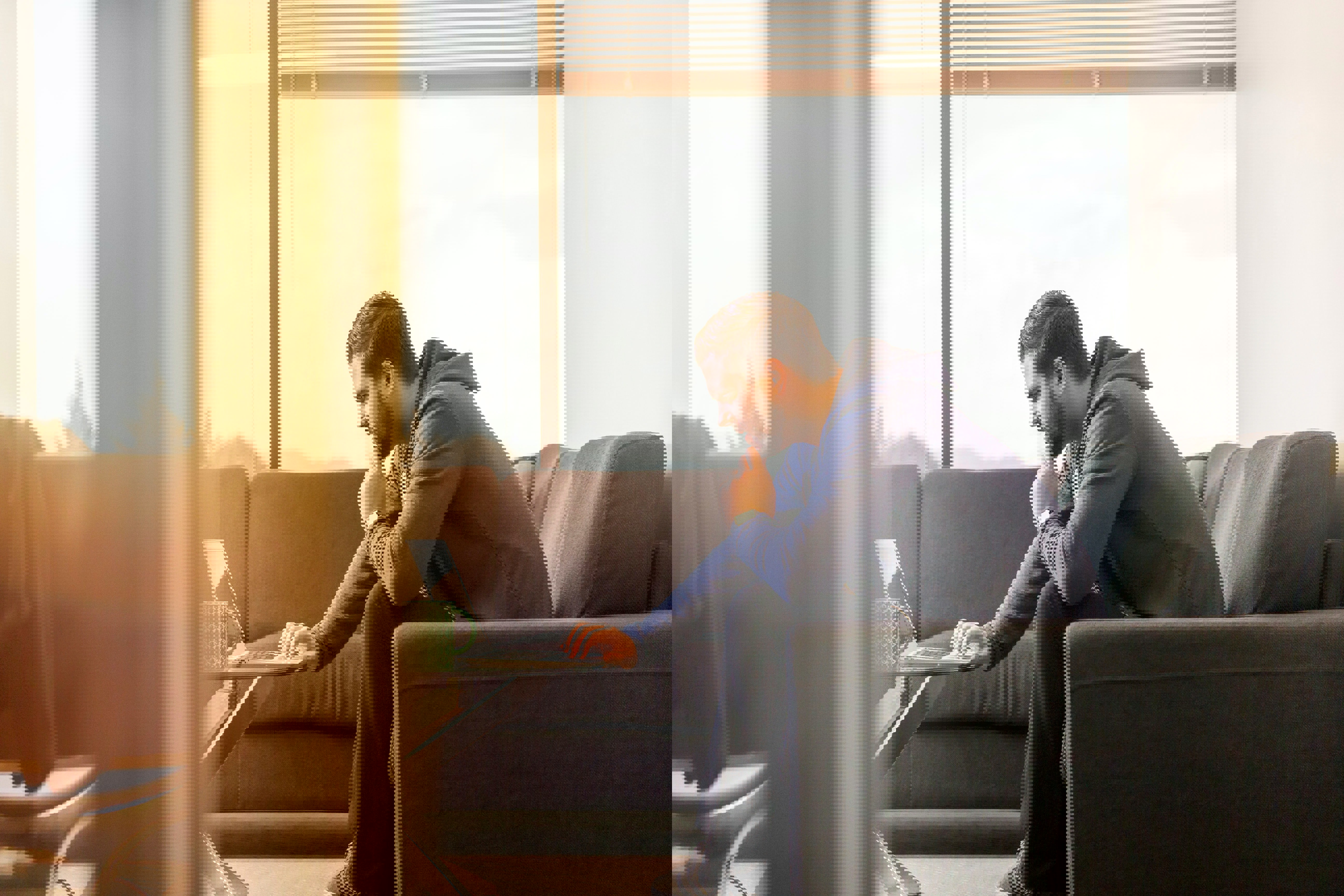 Man looking at computer thinking