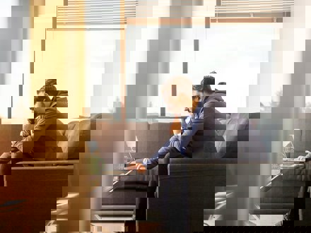 Man looking at computer thinking