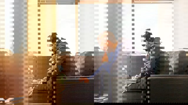 Man looking at computer thinking