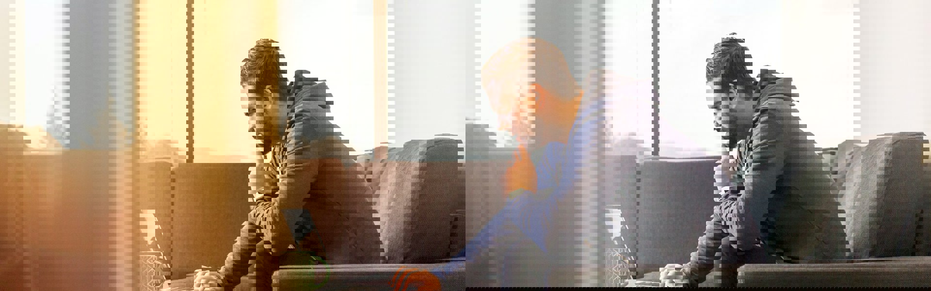 Man looking at computer thinking