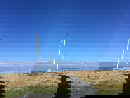 Wind turbines against blue sky