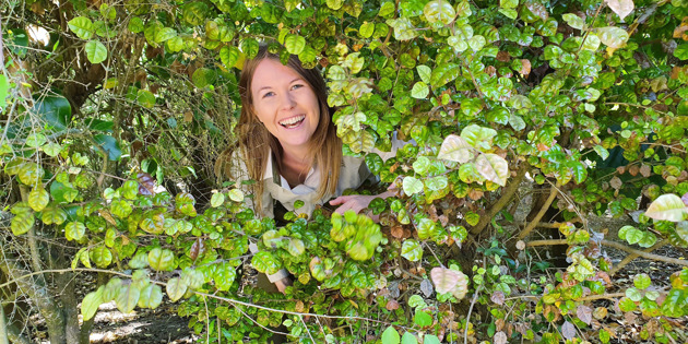 Sam Rowland surrounded by bush
