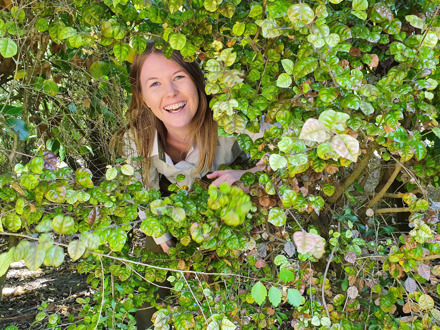 Sam Rowland surrounded by bush