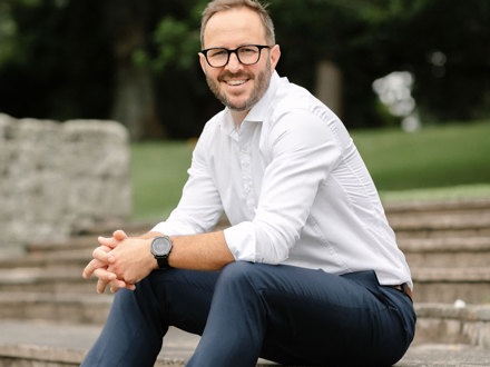 Man sitting on steps in park
