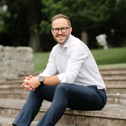 Man sitting on steps in park