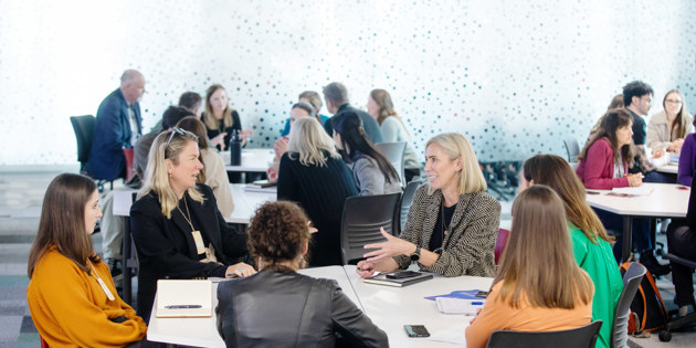 People sitting at a table at a workshop