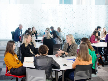 People sitting at a table at a workshop