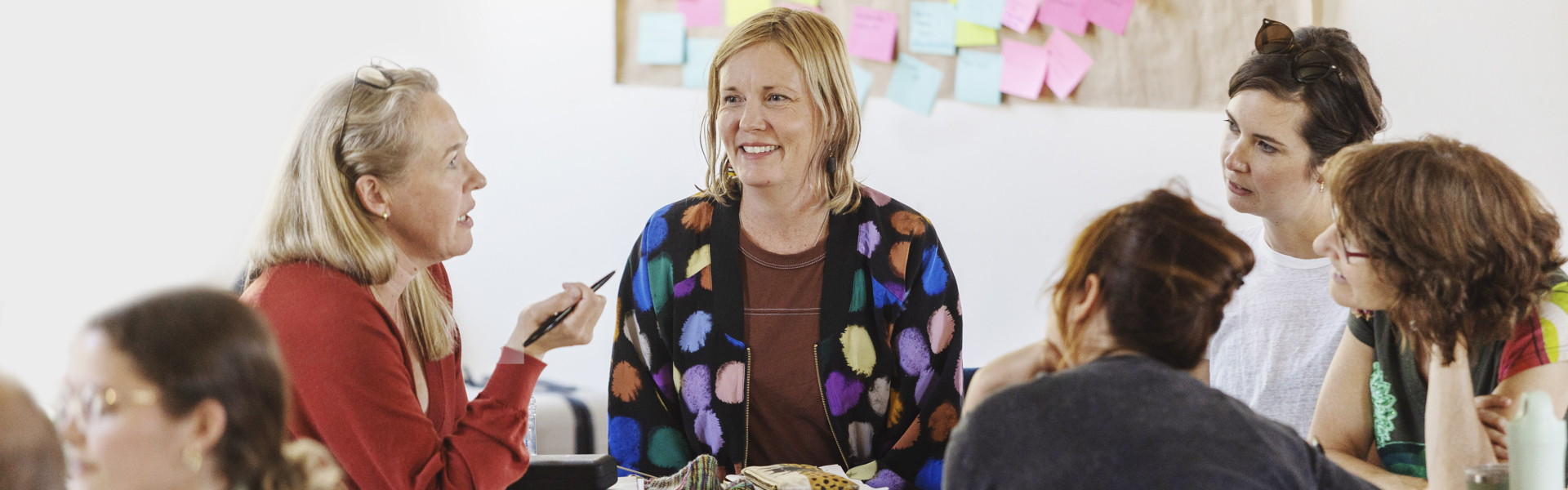 People in discussion around table